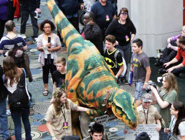 Many people followed the dinosaurs who were performing on the road (11)